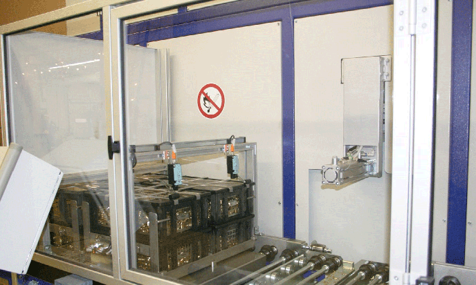 Four of the baskets or pin-racks, used at Superior Products to carry the parts throughout the shop, can be loaded into a carrier system, which was specially designed.